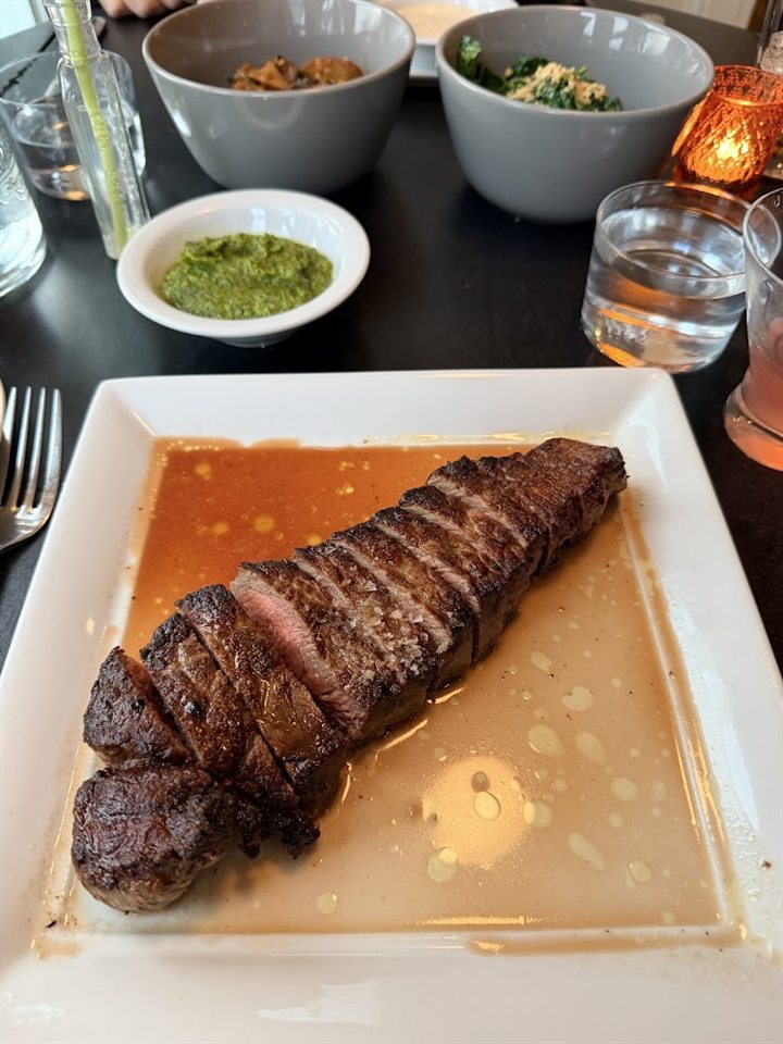 Sliced steak with house sides at Mayville Union House