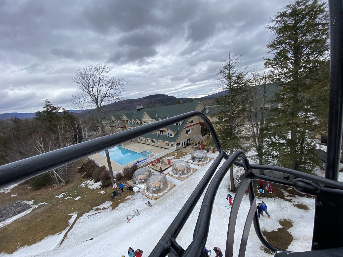The Grand Summit Hotel and outdoor pool seen from a Sunday River chairlift